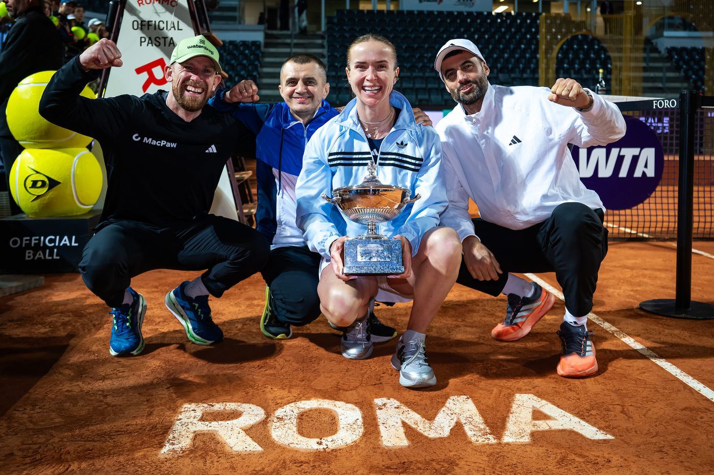 Oleksandr Foka with a WTA player and her team after a tour final