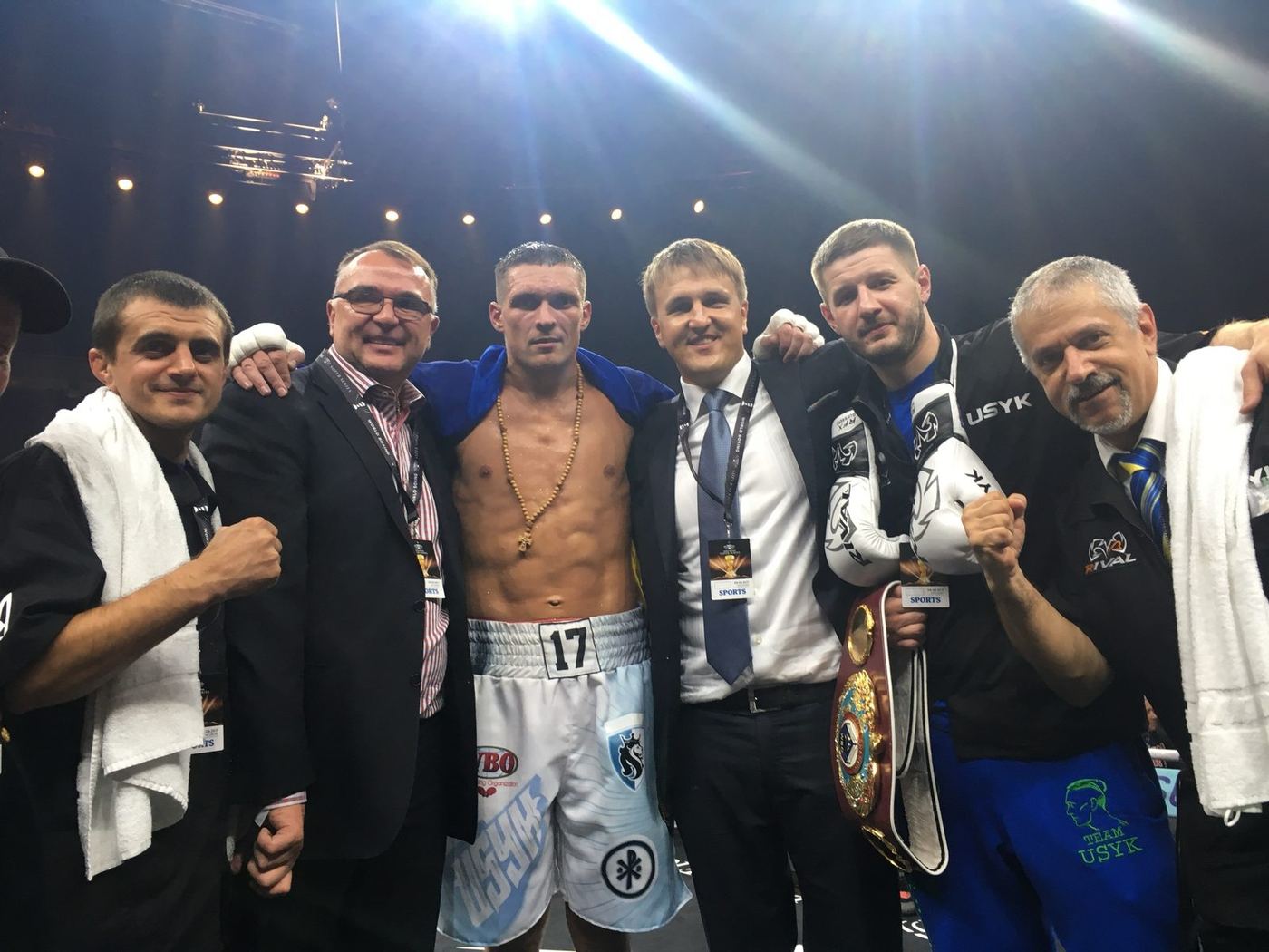 Oleksandr Usyk with his corner team in the ring after stopping Marco Huck in Berlin, 2017